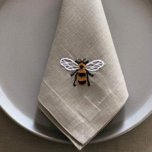 https://www.thenopo.com/cdn/shop/products/the-nopo-mexico-chuytikab-italian-linen-bee-placemats-and-napkins-set-of-4-01_grande.jpg?v=1645102209