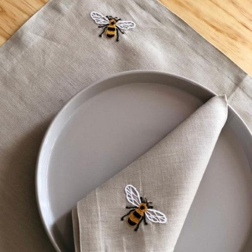 https://www.thenopo.com/cdn/shop/products/the-nopo-mexico-chuytikab-italian-linen-bee-placemats-and-napkins-set-of-4-03_500x500.jpg?v=1645102209